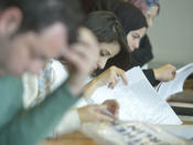 Students studying at a manuscript workshop