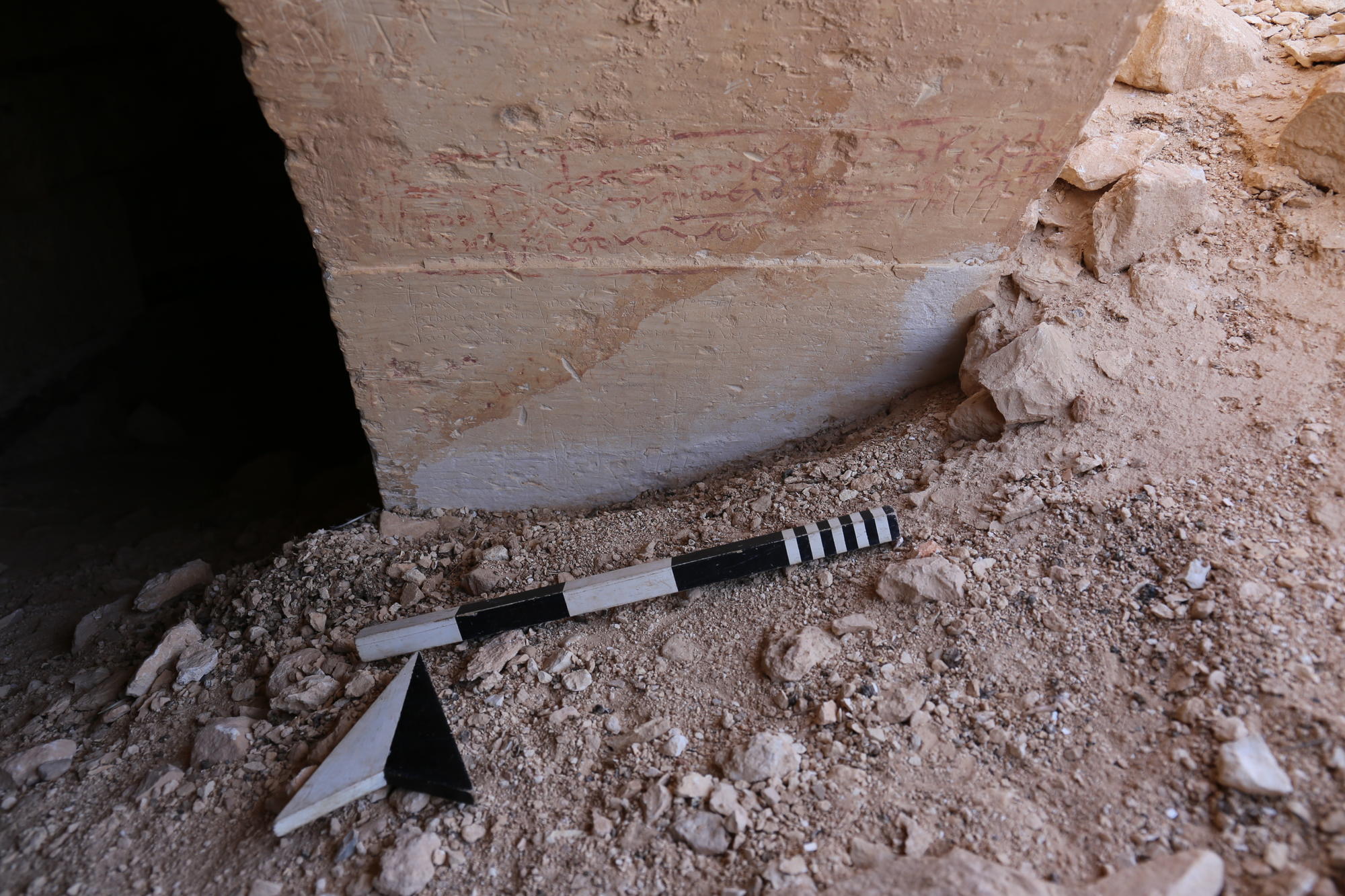Fig.6 Greek pilgrim inscriptions on the arched entrances to the rock-cut spaces (Source: Sina Lehnig)