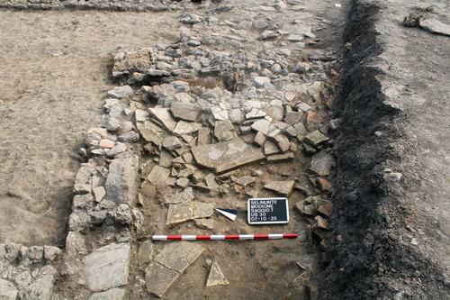 Fig. 10: View of collapsed roof of Room 4 with objects still in situ.