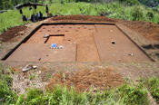 In Area E, 18 aligned postholes were excavated which form the corner of a large building.