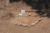 At Bukit Kincir, aligned stone structures were interpreted as grave sites.