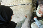 Reading one of King Ādityavarman’s inscriptions.